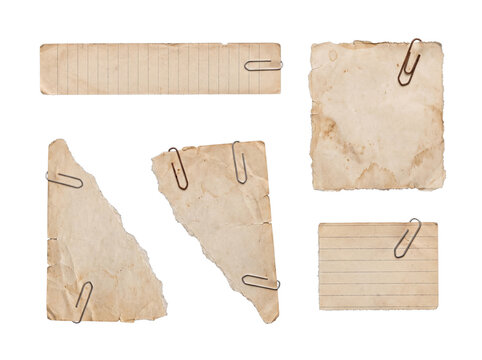 Vintage collection of old, stained paper pieces with metal paper clips, featuring torn edges, isolated on transparent.