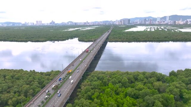mulund airoli bridge aerial view with mangroves
drone view of mulund airoli link bridge mumbai
aerial shot of bridge over mangrove forest mumbai
mumbai bridge with mangroves top view drone
urban bridg