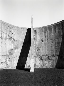Minimal Concrete Wall and Blade Shadow in Circular Court