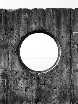 Circular Opening in Weathered Concrete Wall. Minimal abstract portal