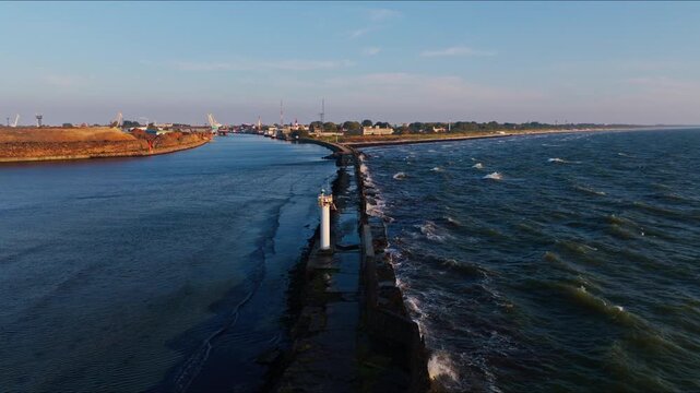 Aerial shows port entrance calm harbor and rough sea Liepaja Latvia