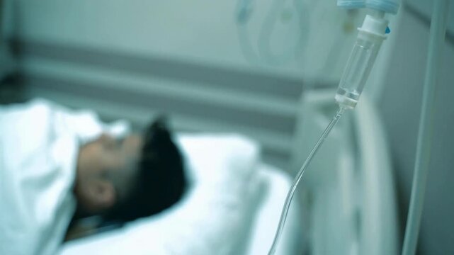 sterile gauze pad blurred background HD after giving intravenous therapy Close-up of a man's arm with an IV needle in the median cubital vein IV