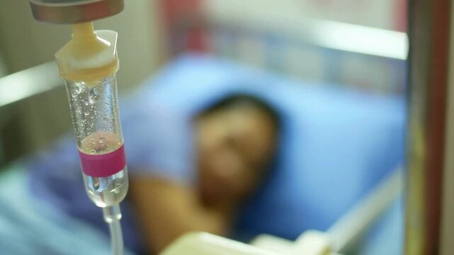 sterile gauze pad blurred background HD after giving intravenous therapy Close-up of a man's arm with an IV needle in the median cubital vein IV