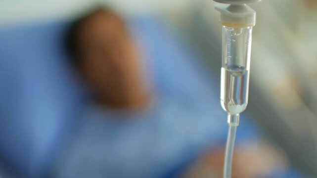 infusion Slow motion healthcare and wellness for blood with background of young woman lying in bed at clinic anesthesia or pharma drugs for pain