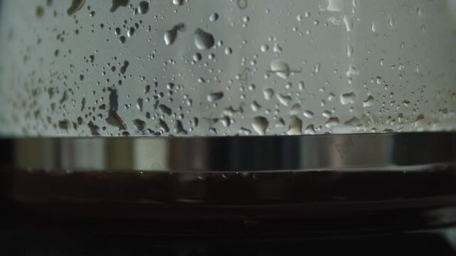 brewing coffee jar close up from boiling coffee maker fresh morning routine in 4k video footage