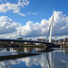 Obraz premium A large white cable-stayed bridge over a river with blue sky