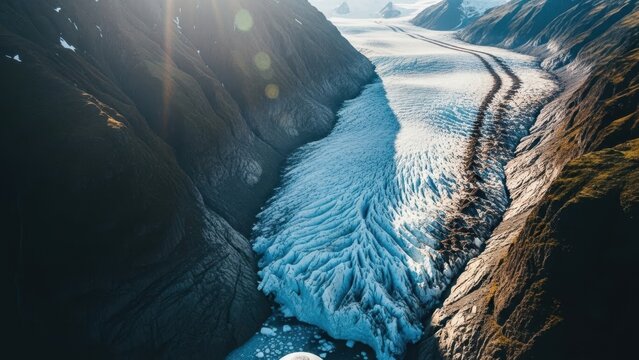 Glacier in mountain valley landscape.