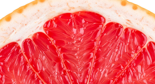Extreme close-up of a pink grapefruit slice highlighting the texture of the juice sacs.