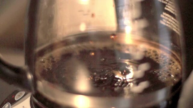 morning brewing coffee maker pouring water close up caffeine drink utensil in footage video