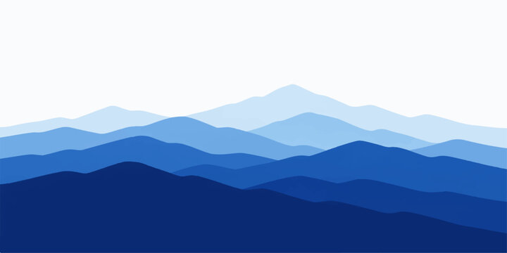 A misty mountain landscape at dawn reveals a blue horizon where sunset clouds float over forest hills and peaks rising from a deep valley