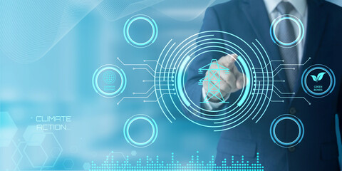 Fototapeta premium Businessman interacting with futuristic holographic interface displaying climate action and green energy concepts for sustainable future innovation
