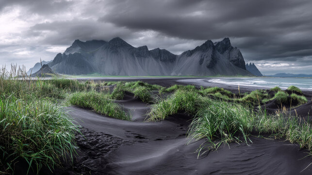 Black sand dunes on the Stokksnes headland on southeastern Icelandic coast with Vestrahorn (Batman Mountain). Picturesque summer panorama of Iceland, Europe. Instagram filter toned.