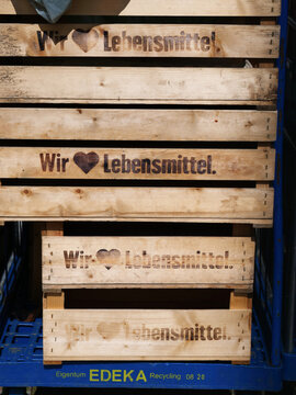 Germany, Paderborn, April 14. 2026, Wooden shipping crates featuring the Edeka Group logo and the slogan: We Love Food
