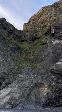 Basalt columns and cave at Reynisfjara black sand beach near Vik, South Iceland