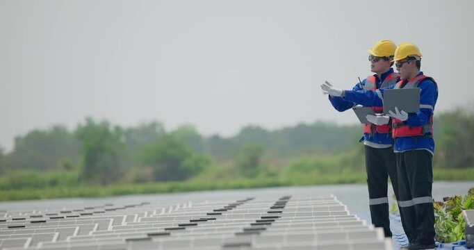 Software engineers collaborate, discuss ways to enhance a smart energy analytics app for floating solar operation. Real-time monitoring optimizes data usage, analyzes efficient consumption insights.
