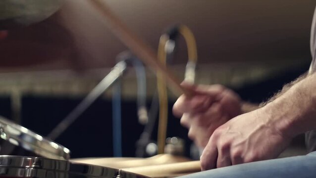 close up performance of a drummer plays with drum