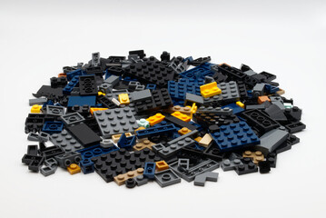 Naklejka premium Bologna - Italy - April 14, 2026: Large pile of diverse plastic LEGO building blocks isolated on white background.