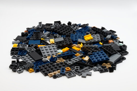 Bologna - Italy - April 14, 2026: Large pile of diverse plastic LEGO building blocks isolated on white background.