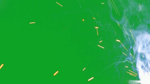 Realistic welding sparks with white smoke plumes on green screen for compositing