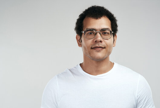 Glasses, entrepreneur and portrait of business man in studio for tech startup, about us and pride. Professional, happy and agency founder with male person on white background for creative and space