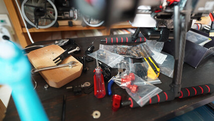 Fototapeta premium Drone Repair Workshop Table with Tools and Spare Parts