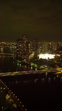 佃のマンション群と隅田川と佃大橋と佃中学校の夜景