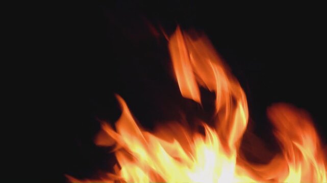 Bright Fire Flames Burning Strongly In Dark Night Background