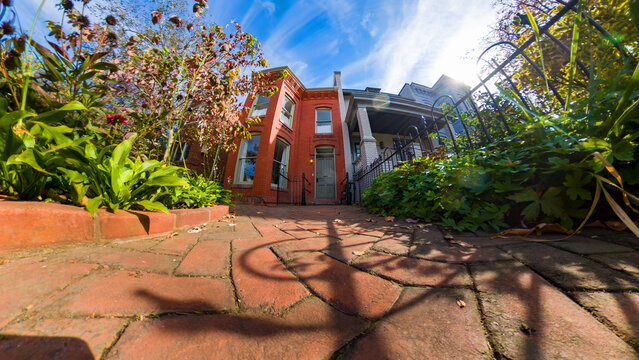 Residential townhouse entrance with brick path in Washington DC