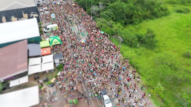 Aerial view of the street block carnival named Samambloco on the street of the town of Campeche, Florianopolis, Brazil