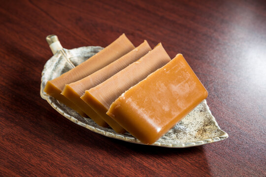 Slices of brown sugar jelly dessert on plate