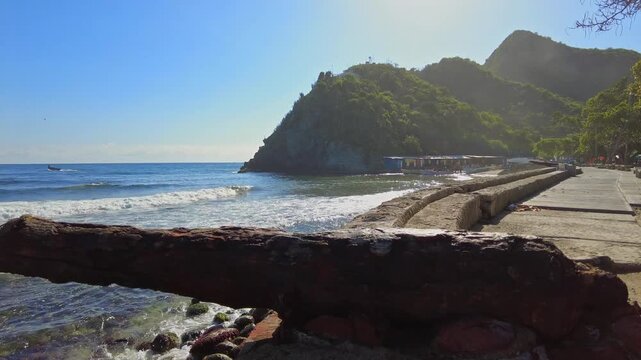Panoramic view of the historic canyons along the Choroni boardwalk on a quiet, peaceful morning, with the sun and mountains in the background, Aragua, Venezuela