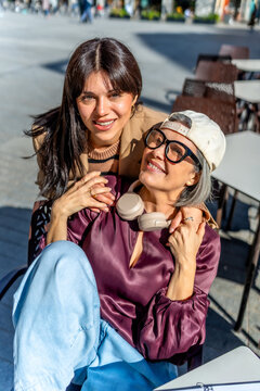 Happy women enjoying time together at outdoor cafe