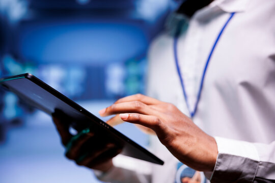 Expert in cryptocurrency server farm with dedicated hardware using Blockchain technology for crypto mining. Fintech professional using asic rigs to solve intricate computational problems, close up