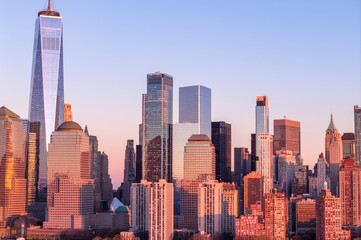 Obraz premium New York skyline at dusk. NYC dusk metropolis skyline. New York big American City. New York City at dusk. New York City. Manhattan at dusk. Lower Manhattan aerial view.