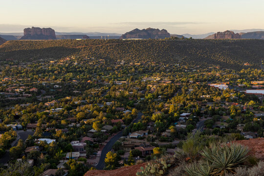 Looking down on valley community in forested landscape from above