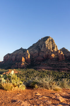 Jagged rock formation in rugged Sedona landscape vertical