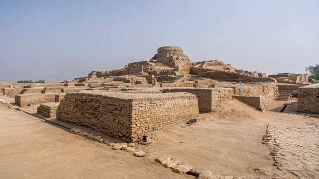 Scenic landscape view of citadel mound with buddhist stupa in archaeological ruins of UNESCO World Heritage Mohenjo Daro, Larkana, Sindh, Pakistan