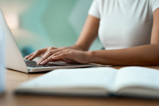 Typing, hands and woman with laptop at desk, online course essay and studying for college assessment. Education, university thesis and student with pc for test preparation, research and learn in home
