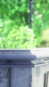 A view shows a railing placed near a path with green leaves and sunlight. The scene captures nature and the details of the railing in the background.
