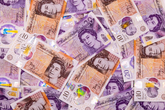 A background with many 20 and 10 pound banknotes, british currency, Elizabeth II