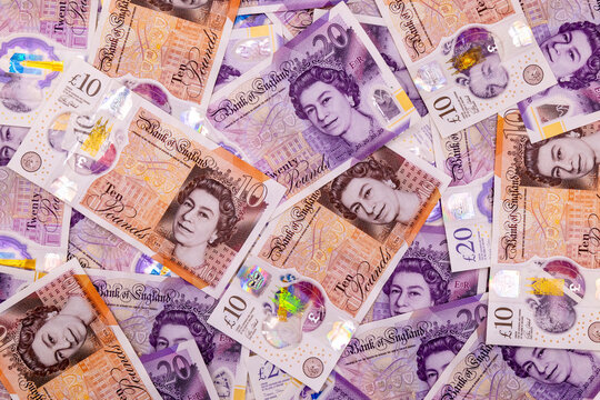 A background with many 20 and 10 pound banknotes, british currency, Elizabeth II