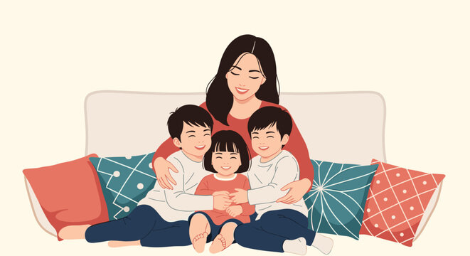 Loving mother sits on a sofa and warmly embraces her three young children who are smiling and feeling happy together in their home.