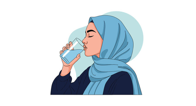 Beautiful Muslim woman wearing a light blue hijab takes a refreshing drink of cool water from a clear glass cup.