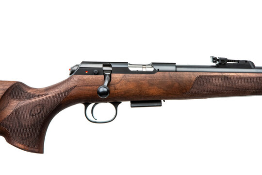 Close-up of a bolt-action rifle receiver with a wooden stock isolated on a white back