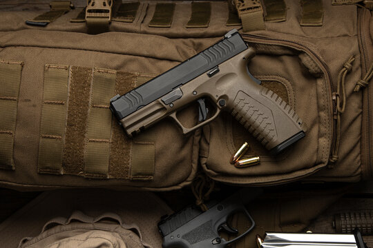 Tactical Handgun on Military Backpack