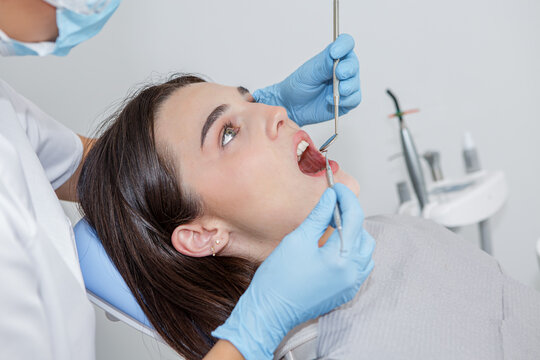 Dentist provides dental care to a patient in a dental clinic setting
