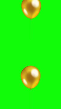 Golden balloon flying on green background