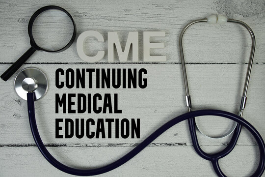 CME Continuing Medical Education text with Stethoscope on wooden background
