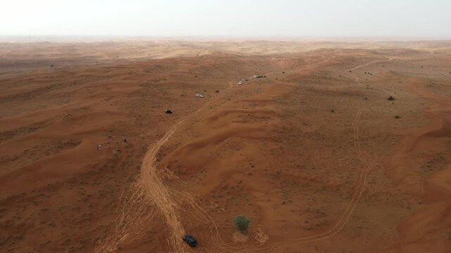A drone shot capturing the vast landscape of the Arabian Desert in the UAE.