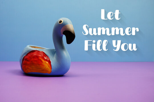 Let Summer Fill You text with famingo figure on blue and purple background